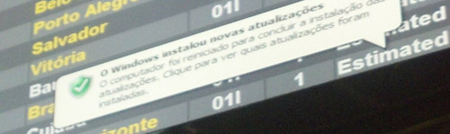 Picture shows an Operating System update pop up which is common in airports in Brazil