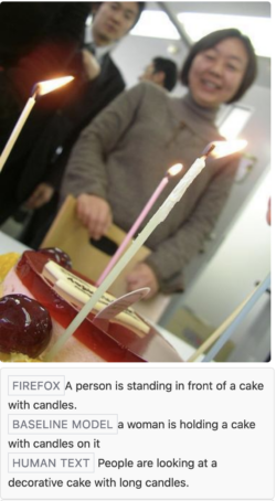 A person is standing in front of a cake with candles.